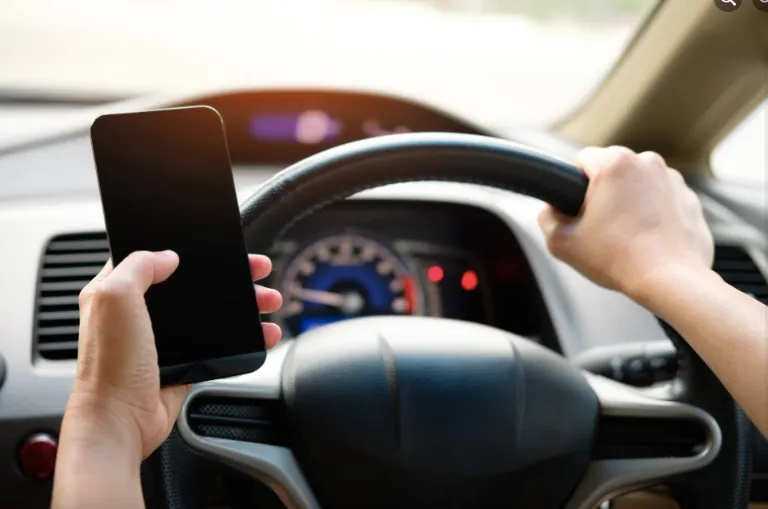 Someone texting and driving.