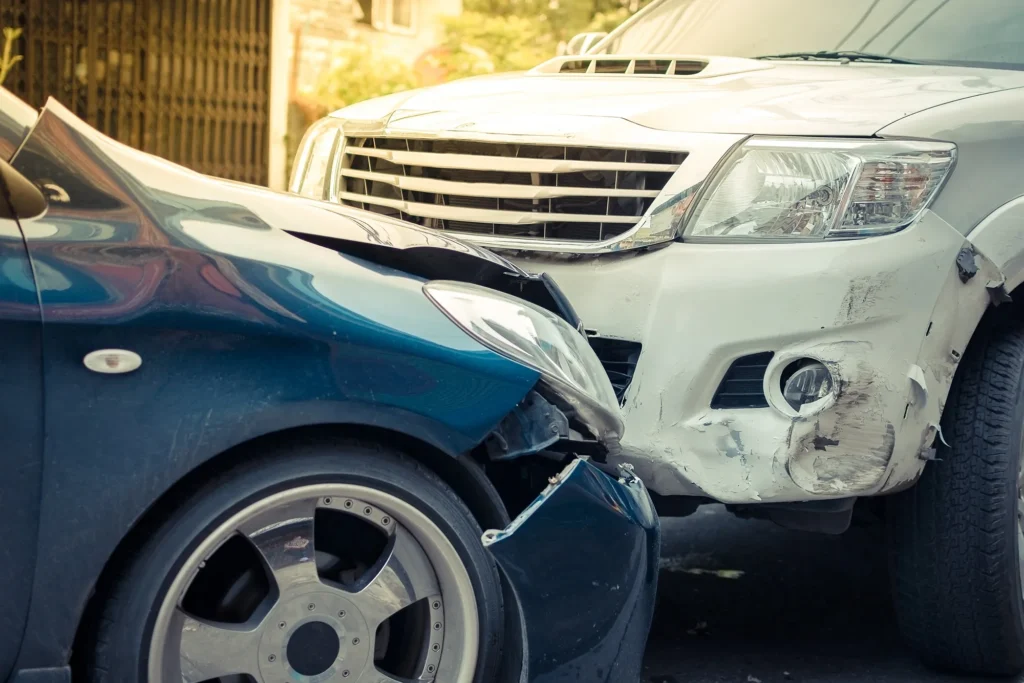 Two cars getting in a car accident.